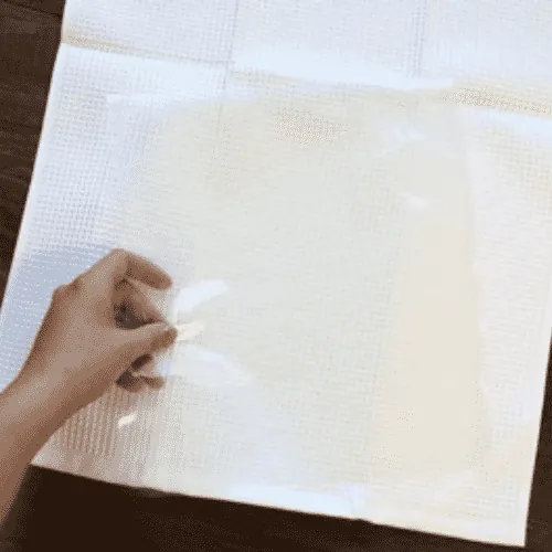 Apply a stabilizer to the part of the towel you're preparing to embroider.