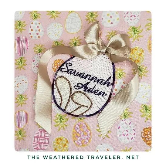 Personalized Easter egg basket name tag embroidered with bunny ears and a satin bow