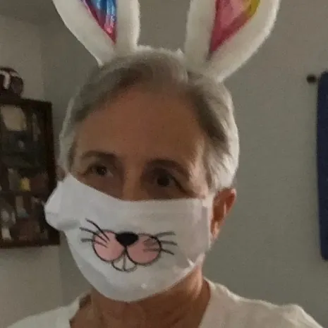 Embroidered bunny nose, teeth and whiskers on a white Easter face mask
