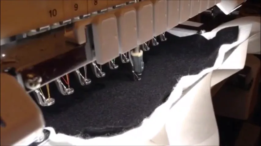 Black felt stitched down onto stabilizer in the embroidery hoop