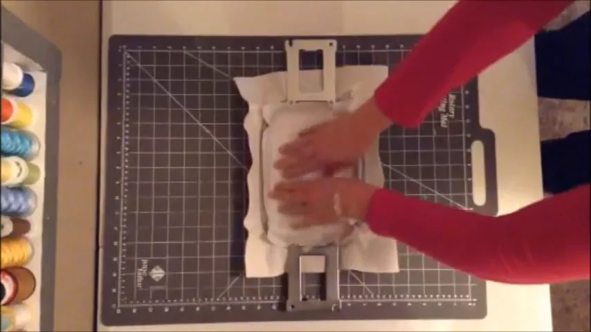 Hooping two layers of cutaway stabilizer and smoothing them before stitching a patch