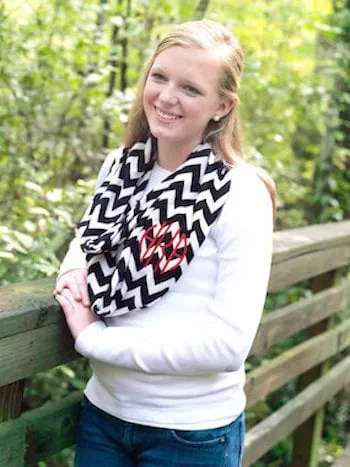 Teen girl wearing monogrammed scarf