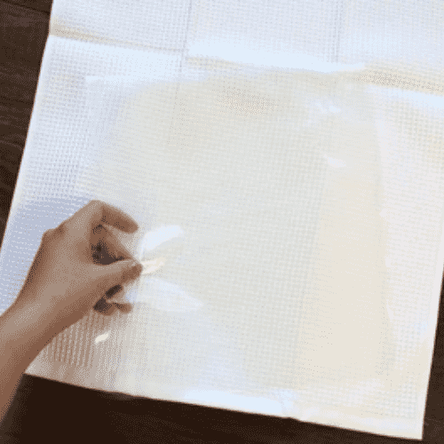 Apply a stabilizer to the part of the towel you're preparing to embroider.