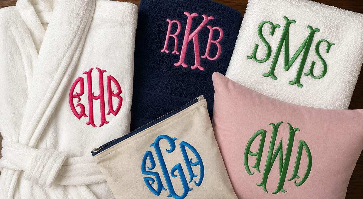 A fishtail monogram has that finished boutique look before you add anything else. The letter ends flare with movement, so the initial does not feel flat or plain.