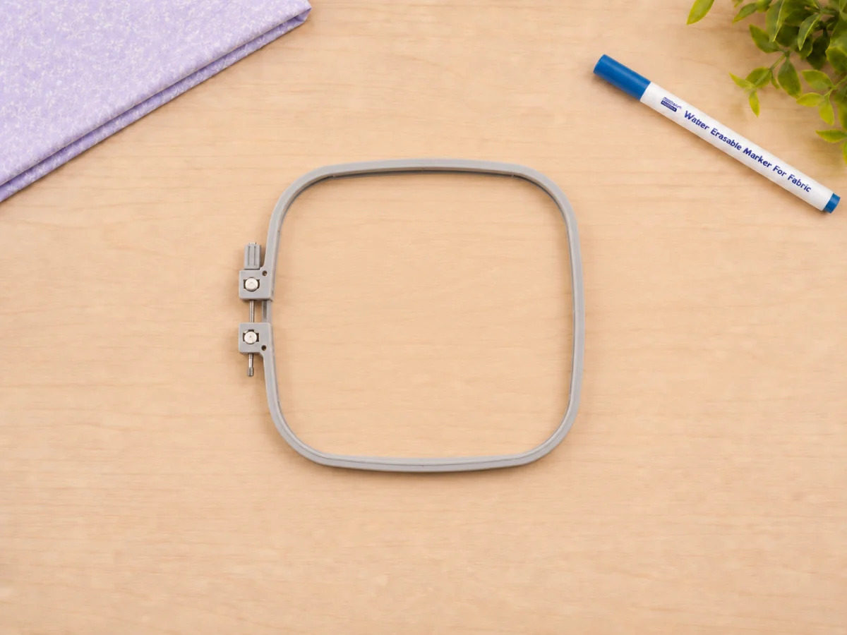 Loosen the embroidery hoop before placing fabric to avoid wrinkles and uneven pressure.