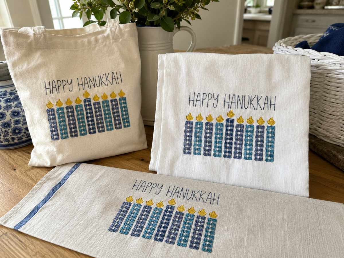 The Happy Hanukkah Embroidery Design combines festive lettering with candle imagery.