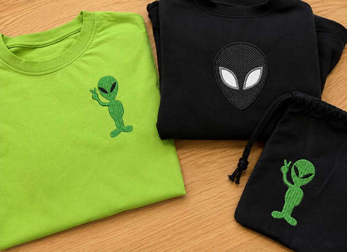The classic alien embroidery design is simple: a large head, dark eyes and a face that clearly does not belong on Earth.