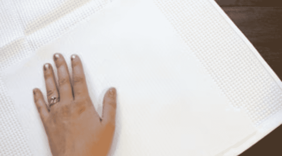 Iron the embroidered area flat before you start embroidering.