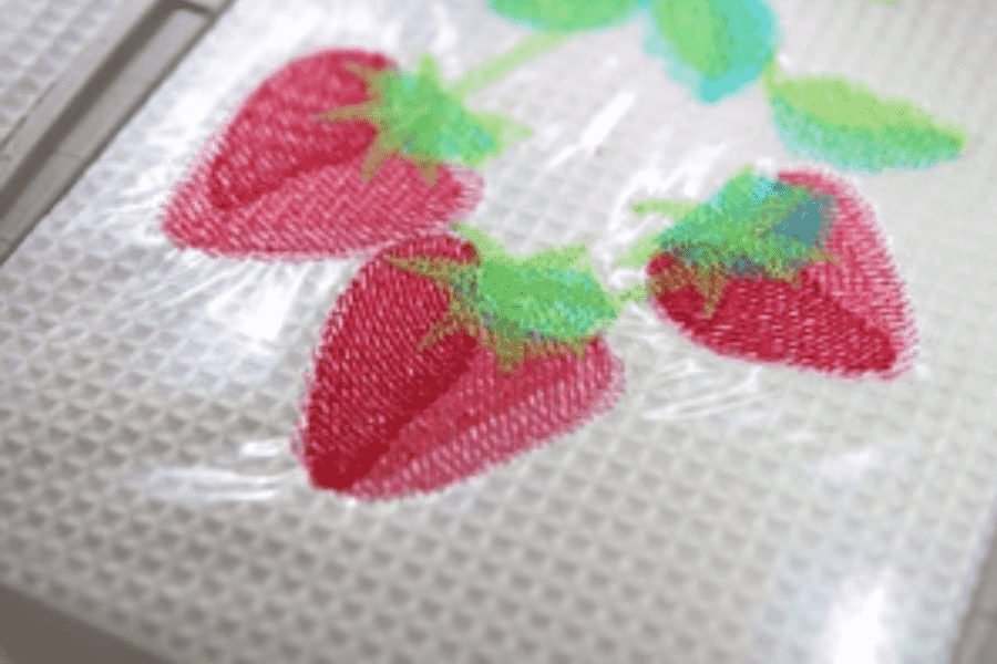 Apply a water-soluble coating to the embroidered surface.