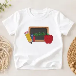Back to school supplies embroidery design with chalkboard, pencil, books and apple stitched on a white kids T-shirt
